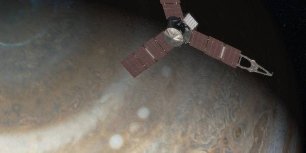 An artist's rendering depicts NASA's Juno spacecraft above Jupiter's north pole in this undated handout image. NASA/JPL-Caltech/Handout via Reuters/File photo ATTENTION EDITORS - THIS IMAGE WAS PROVIDED BY A THIRD PARTY. EDITORIAL USE ONLY