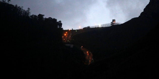 The border fence which separates Morocco and Spain's north African enclave of Ceuta is seen as it is illuminated, Spain, December 11, 2016. REUTERS/Juan Medina