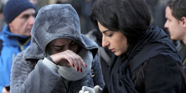 Women who survived an attack by a gunman, react outisde the Reina nightclub by the Bosphorus, in Istanbul, Turkey, January 1, 2017. REUTERS/Huseyin Aldemir TPX IMAGES OF THE DAY