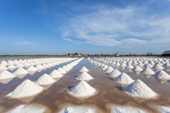 Salt in a sea salt farm ready for harvest in Thailand.