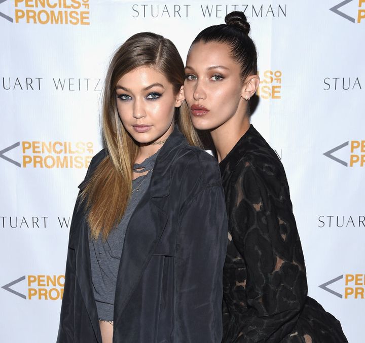 Gigi shows how to do a sleek side part while Bella goes for another high bun.
