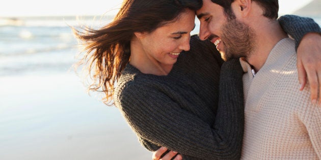 Young couple in love look each other at home in the morning