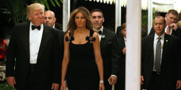 U.S. President-elect Donald Trump and his wife Melania Trump arrive for a New Year's Eve celebration with members and guests at the Mar-a-lago Club in Palm Beach, Florida, U.S. December 31, 2016. REUTERS/Jonathan Ernst
