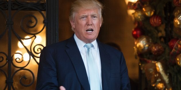 US President-elect Donald Trump answers questions from the media after a day of meetings on December 28, 2016 at Mar-a-Lago in Palm Beach, Florida. / AFP / DON EMMERT (Photo credit should read DON EMMERT/AFP/Getty Images)