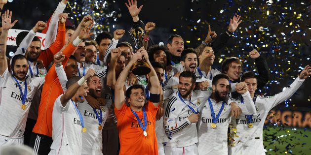 Players pose with the trophy after the FIFA World Cup Final between Real Madrid and San Lorenzo at Marrakech Stadium on December 20, 2014 in Marrakech, Morocco.