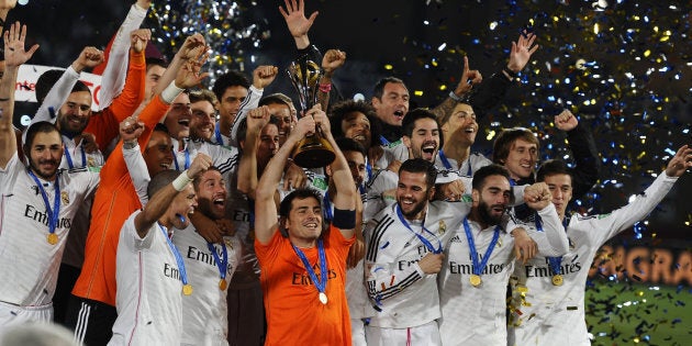 Players pose with the trophy after the FIFA World Cup Final between Real Madrid and San Lorenzo at Marrakech Stadium on December 20, 2014 in Marrakech, Morocco.