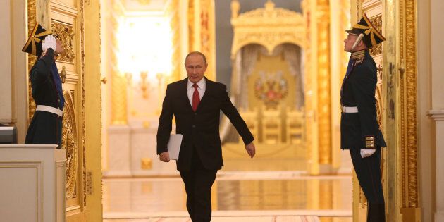 RUSSIA, MOSCOW - DECEMBER 1: (RUSSIA OUT) Russian President Vladimir Putin enters the hall to deliver his annual speech to the Federal Assembly at Grand Kremlin Palace on December, 1, 2016 in Moscow, Russia. Putin spoke favorably towards future bilateral ties with the US once Donald Trump takes office in January. (Photo by Mikhail Svetlov/Getty Images)