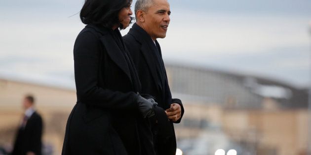 U.S. President Barack Obama and first lady Michelle Obama arrive to board Air Force One for travel to Chicago to deliver a farewell address, from Joint Base Andrews, Maryland, U.S. January 10, 2017. REUTERS/Jonathan Ernst