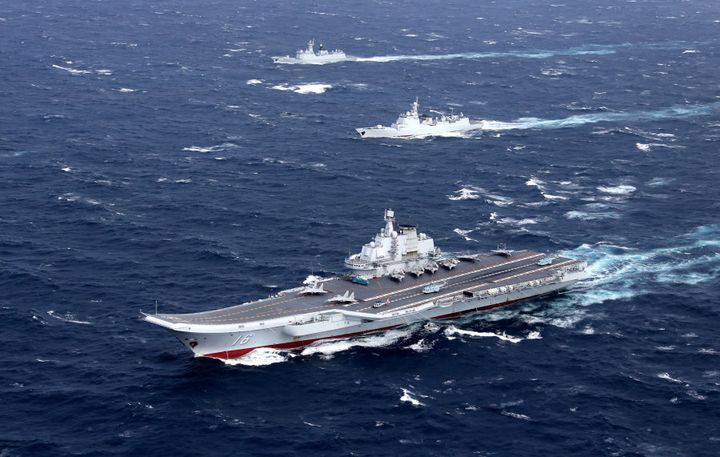 China's Liaoning aircraft carrier with accompanying fleet conducts a drill in an area of South China Sea, in this undated photo taken December, 2016.