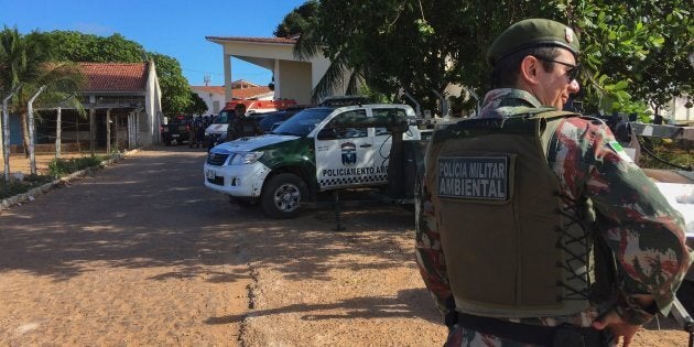 An agent of the Military Police stands guard at the Alcacuz Penitentiary Center near Natal, Rio Grande do Norte state, northeastern Brazil.