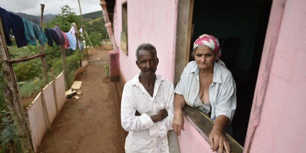 Pedro Joel de Oliveira and Teresinha Gomes de Oliveira, the parents of a victim of suspected yellow fever, stand at their home in the southeastern Brazilian state of Minas Gerais on Friday. Health authorities of Minas Gerais decreed a health emergency in 152 cities and towns due to a likely outbreak of yellow fever.