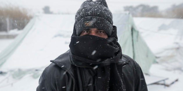 Hundreds of refugees face the extreme low temperatures in northern Greece in camps in or around Thessaloniki city on 11 January 2017. In Softex camp the temperature was -8°C with real feeling sense below -13°C and there was about 20cm of snowfall during a half day heaby snowstorm. The tents were snow covered. There is no running water as the pipes froze and many tents don't have electricity and heating. Also many refugees without document have been forced to leave the camp. (Photo by Nicolas Economou/NurPhoto via Getty Images)