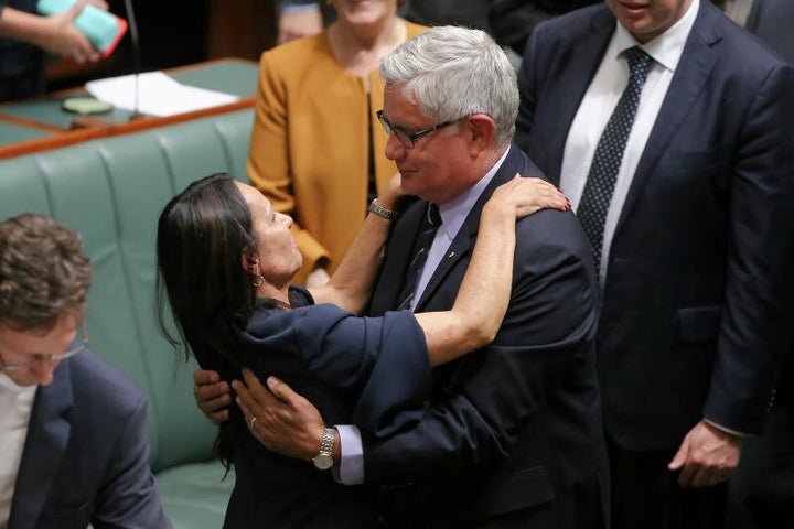 Ken Wyatt embraces Linda Burney, first Aboriginal woman in the House of Representatives, after she delivered her maiden speech