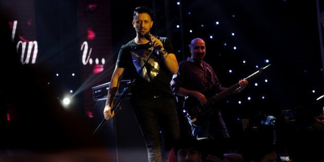 DHAKA, BANGLADESH - MAY 30: Celebrated Pakistani playback singer Atif Aslam performs at ‘Rhythm for All with Atif Aslam Night Live in Dhaka’ at the Navratri Hall of International Convention City Bashundhara on MaY 30, 2016 in Dhaka, Bangladesh. Atif Aslam is a Pakistani singer and film actor. His debut movie was the 2010 social drama Bol - one of the highest-grossing Pakistani films of all time. (Photo by Sk Hasan Ali/Corbis via Getty Images)