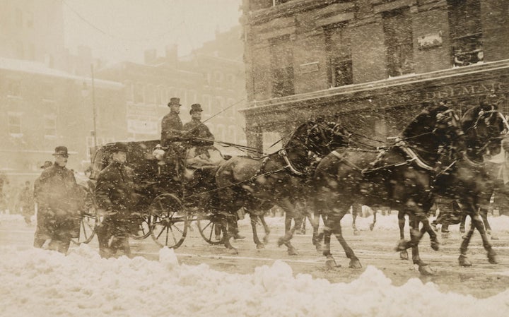 William Howard Taft and President Theodore Roosevelt head through a snowstorm to the Capitol for Taft's inauguration in 1909.