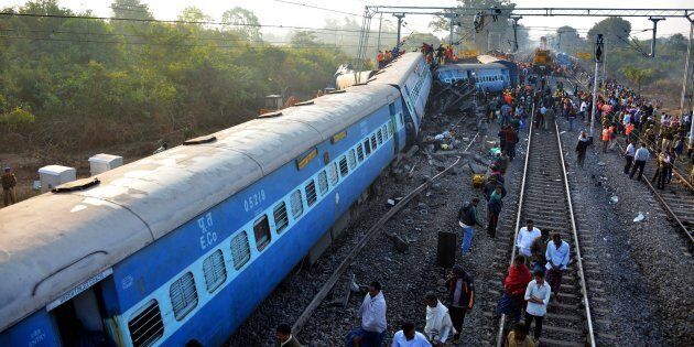 Rescue workers search for victims at the site of the derailment of the Jagdalpur-Bhubaneswar express train near Kuneru station in southern Andhra Pradesh state on January 22, 2017. (STRINGER/AFP/Getty Images)