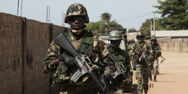 BANJUL, GAMBIA - JANUARY 22: ECOWAS troops patrol in the streets of Barra town after the former President Yahya Jammeh left the country, in Banjul, Gambia on January 22, 2017. Yahya Jammeh left Gambia after agreeing to relinquish power earlier in the day, bring an end to a political crisis that has gripped the country since his election defeat last month. (Photo by Xaume Olleros/Anadolu Agency/Getty Images)