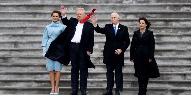 U.S. First Lady Melania Trump, from left, U.S. President Donald Trump, Vice President Mike Pence, and Second Lady Karen Pence wave on the West Front of the U.S. Capitol after the 58th presidential inauguration in Washington, D.C., U.S., on Friday, Jan. 20, 2017. Trump became the 45th president of the United States today, in a celebration of American unity for a country that is anything but unified Photographer: Rob Carr/Pool via Bloomberg