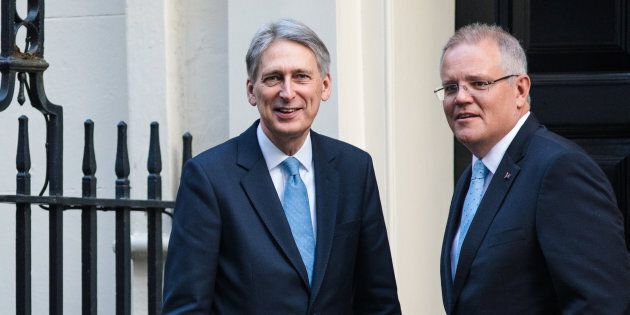 LONDON, ENGLAND - JANUARY 24: British Chancellor of the Exchequer Philip Hammond greets Scott Morrison (R) outside Number 11 Downing Street on January 24, 2017.