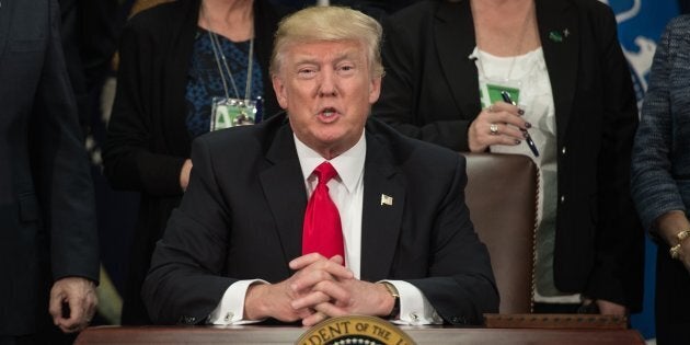 US President Donald Trump speaks after signing an executive order to start the Mexico border wall project at the Department of Homeland Security facility in Washington, DC, on January 25, 2017. / AFP / NICHOLAS KAMM (Photo credit should read NICHOLAS KAMM/AFP/Getty Images)