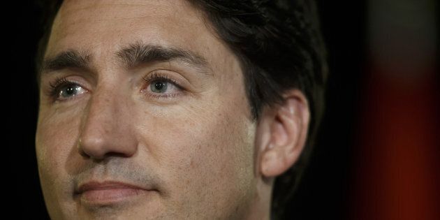 Justin Trudeau, Canada's prime minister, listens during a news conference following a town hall event in Kingston, Ontario, Canada, on Thursday, Jan. 12, 2017. Trudeau confirmed that his senior advisers have met with U.S. President-elect Donald Trump's officials. Photographer: Cole Burston/Bloomberg via Getty Images