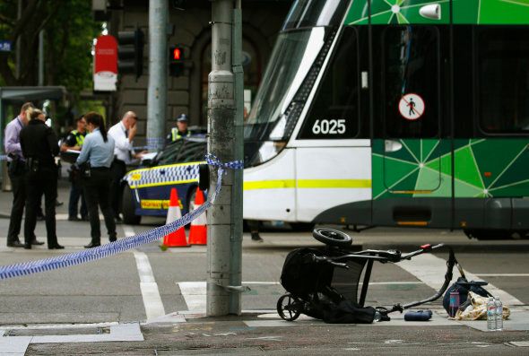 A pram is seen as police cordon off Bourke Street mall, after a car hit pedestrians in central Melbourne