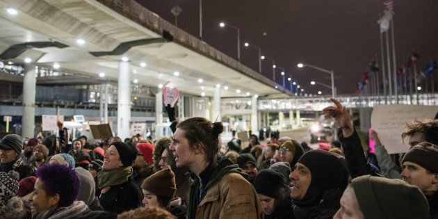 Thousands fill the street outside Terminal 5 of O'Hare International Airport in Chicago in protest of President Trump's order to ban people from seven predominantly Muslim countries from entering the United States.