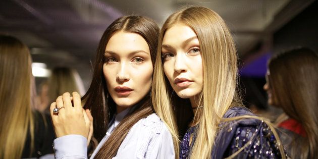 MILAN, ITALY - SEPTEMBER 23: Bella Hadid and Gigi Hadid backstage at the Versace Ready to Wear show during Milan Fashion Week Spring/Summer 2017 on September 23, 2016 in Milan, Italy. (Photo by Victor VIRGILE/Gamma-Rapho via Getty Images)