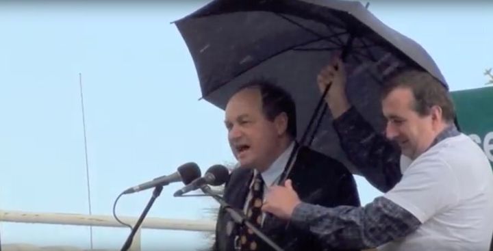 David Archibald gives a speech in the rain in 2011
