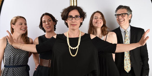 NEW YORK, NY - MAY 31: Journalist Sarah Koenig (center) poses with her award with Ira Glass (R) and guests and at The 74th Annual Peabody Awards Ceremony at Cipriani Wall Street on May 31, 2015 in New York City. (Photo by Mike Coppola/Getty Images for Peabody Awards)