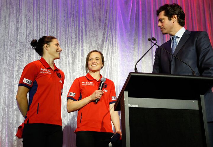 Melissa Hickey (left) and Daisy Pearce of the Demons chat with Gillon McLachlan during the Women's League marquee player announcement on July 27, 2016 in Melbourne.