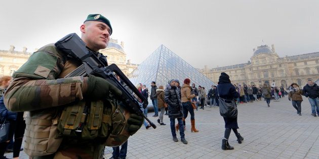 French police officers and soldiers patrol in front of the Louvre museum on February 3, 2017 in Paris after a soldier has shot and gravely injured a man who tried to attack him.'Serious public security incident under way in Paris in the Louvre area,' the interior ministry tweeted on February 3 as streets in the area were cordoned off to traffic and pedestrians. / AFP / ALAIN JOCARD (Photo credit should read ALAIN JOCARD/AFP/Getty Images)