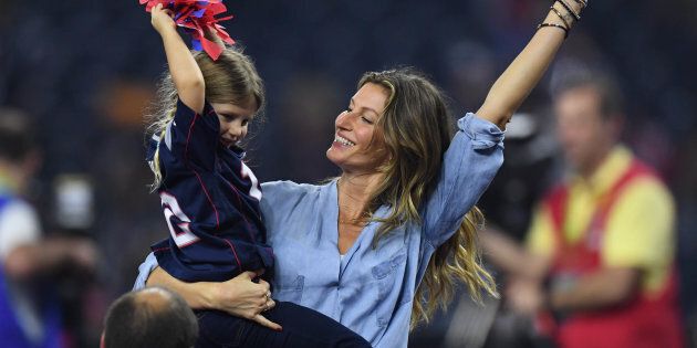Feb 5, 2017; Houston, TX, USA; Gisele Bundchen and her daughter Vivian Brady celebrate after the game between the Atlanta Falcons and the New England Patriots during Super Bowl LI at NRG Stadium. The Patriots won 34-28. Mandatory Credit: Bob Donnan-USA TODAY Sports