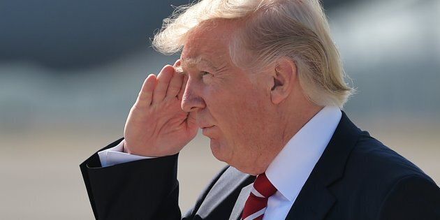 US President Donald Trump salutes upon arrival at MacDill Air Force Base on February 6, 2017 in Tampa, Florida to visit the US Central Command and Specials Operations Command. / AFP / MANDEL NGAN (Photo credit should read MANDEL NGAN/AFP/Getty Images)