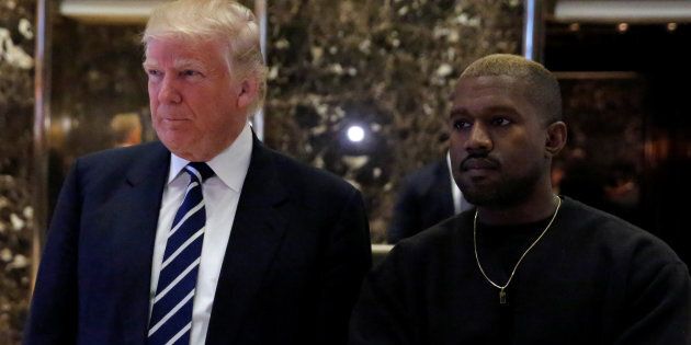 U.S. President-elect Donald Trump and musician Kanye West pose for media at Trump Tower in Manhattan, New York City, U.S., December 13, 2016. REUTERS/Andrew Kelly