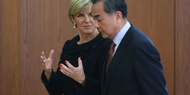Chinese Foreign Minister Wang Yi (R) and Australian Foreign Minister Julie Bishop talk after a joint press conference at the Ministry of Foreign Affairs in February last year.