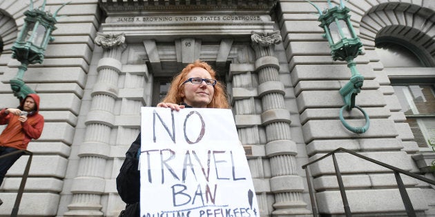 Beth Kohn protests outside the 9th U.S. Circuit Court of Appeals courthouse in San Francisco, California February 7, 2017, while the Court hears arguments regarding President Donald Trump's temporary travel ban on people from seven Muslim-majority countries. REUTERS/Noah Berger