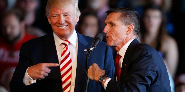 GRAND JUNCTION, CO - OCTOBER 18: Republican presidential candidate Donald Trump (L) jokes with retired Gen. Michael Flynn as they speak at a rally at Grand Junction Regional Airport on October 18, 2016 in Grand Junction Colorado. Trump is on his way to Las Vegas for the third and final presidential debate against Democratic rival Hillary Clinton. (Photo by George Frey/Getty Images)