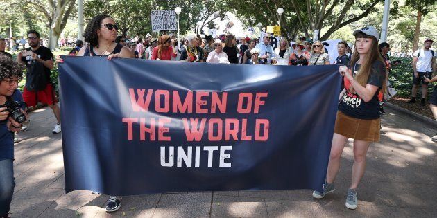 Women protestors march in a rally against US President Donald Trump following his inauguration, in Sydney on January 21, 2017.