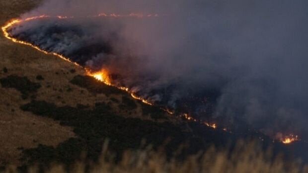 A line of fire burns across Port Hills, south of Christchurch