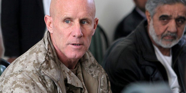 Vice Adm. Robert S. Harward, commanding officer of Combined Joint Interagency Task Force 435, speaks to an Afghan official during his visit to Zaranj, Afghanistan, in this January 6, 2011 handout photo. The visit consisted of a tour of a provincial prison, the Iran/Afghanistan border crossing and an airfield assessment. Sgt. Shawn Coolman/U.S. Marines/Handout via REUTERS ATTENTION EDITORS - THIS IMAGE WAS PROVIDED BY A THIRD PARTY. EDITORIAL USE ONLY