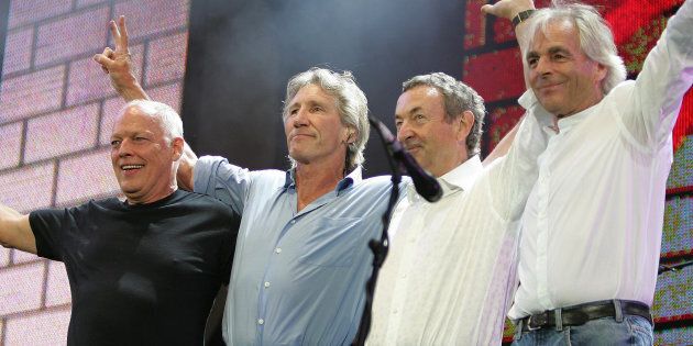 (L to R) British rock stars, Dave Gilmour, Roger Waters, Nick Mason and Rick Wright of Pink Floyd, perform at the Live 8 concert in Hyde Park in London July 2, 2005. A galaxy of rock and roll stars will grace stages across the globe on Saturday for what is being billed as the greatest music show ever, in a bid to put pressure on leaders of the Group of Eight major industrialised nations meeting in Scotland next week to do more to alleviate poverty, particularly in Africa. Live 8, an expanded version of the Live Aid sensation 20 years ago, will take in 10 cities and four continents, kicking off in Tokyo in the east and ending in North America in the west. REUTERS/Stephen Hird MFK/CN