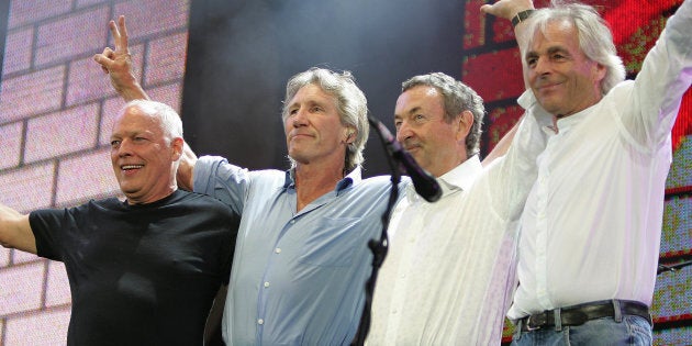 (L to R) British rock stars, Dave Gilmour, Roger Waters, Nick Mason and Rick Wright of Pink Floyd, perform at the Live 8 concert in Hyde Park in London July 2, 2005. A galaxy of rock and roll stars will grace stages across the globe on Saturday for what is being billed as the greatest music show ever, in a bid to put pressure on leaders of the Group of Eight major industrialised nations meeting in Scotland next week to do more to alleviate poverty, particularly in Africa. Live 8, an expanded version of the Live Aid sensation 20 years ago, will take in 10 cities and four continents, kicking off in Tokyo in the east and ending in North America in the west. REUTERS/Stephen Hird MFK/CN