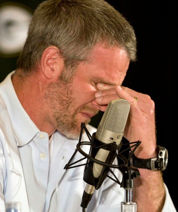 Brett Favre, the former Green Bay Packers' quarterback, holds back the tears after announcing his retirement from the NFL after 17 seasons.