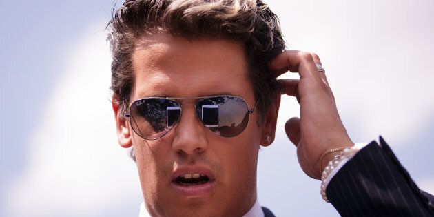 ORLANDO, FL - JUNE 15: Milo Yiannopoulos, a conservative columnist and internet personality, looks at his tablet device during a press conference down the street from the Pulse Nightclub, June 15, 2016 in Orlando, Florida. Yiannopoulos was briefly banned from Twitter on Wednesday. The shooting at Pulse Nightclub, which killed 49 people and injured 53, is the worst mass-shooting event in American history. (Photo by Drew Angerer/Getty Images)