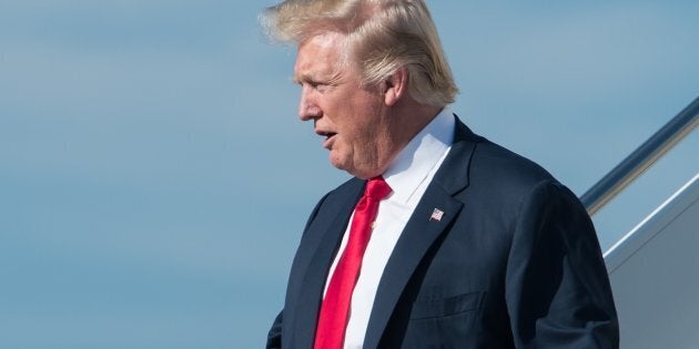 US President Donald Trump arrives at Palm Beach International Airport in Florida to spend the weekend at his Mar-a-Lago resort on February 17, 2017. / AFP / NICHOLAS KAMM (Photo credit should read NICHOLAS KAMM/AFP/Getty Images)