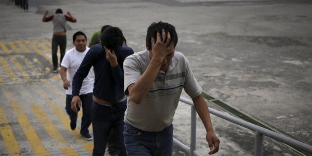 Illegal migrants from Guatemala, deported from the U.S., arrive at an air force base in Guatemala City, March 19, 2015. The flight carrying some 150 illegal migrants arrived on Thursday, according to authorities. REUTERS/Jorge Dan Lopez