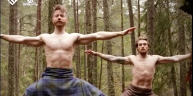 Men in store kilts doing yoga