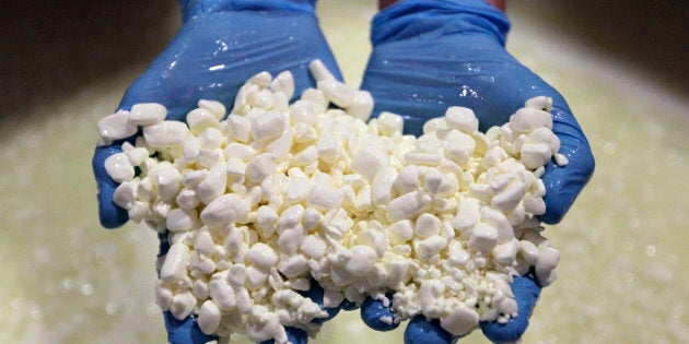 In this June 25, 2012 photo, cheese maker, Britton Comer, checks the curds as he makes a batch of cottage cheese at Traders Point Creamery in Zionsville, Ind. Traders Point is one of the few well known high-end cottage cheese makers, along with Cowgirl Creamery in northern California. (AP Photo/Michael Conroy)