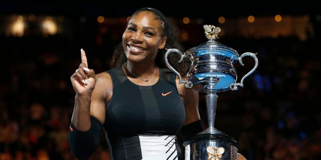 Tennis - Australian Open - Melbourne Park, Melbourne, Australia - 28/1/17 Serena Williams of the U.S. gestures while holding her trophy after winning her Women's singles final match against Venus Williams of the U.S. .REUTERS/Issei Kato TPX IMAGES OF THE DAY